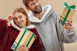 a couple wearing blanket hoodies