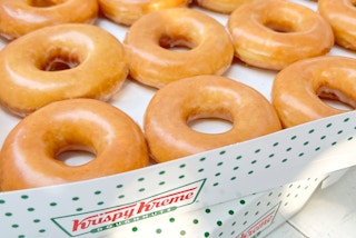 stacked boxes of krispy kreme original glazed doughnuts