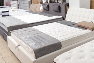 mattresses on display at a furniture store