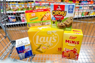 walmart oscar mayer, quaker, lay's, red bull, eggo items in a shopping cart