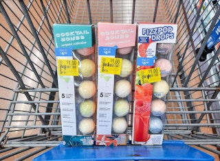 Cocktail Bomb and Fizzpop Drop products in Walmart shopping cart. Each item has a $1 clearance tag attached to the box.