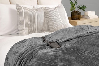 a sunbeam electric blanket on a bed