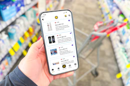 hand holding a smartphone displaying 1-clip deals in the kcl app