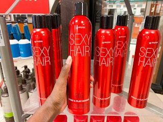 hand holding hairspray