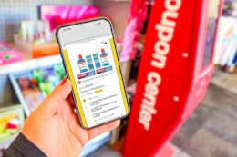 hand holding a smartphone displaying a 1-clip deal in the kcl app