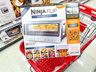 ninja flip air fryer toaster oven sitting on top a target cart