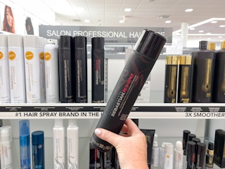 Someone holding up a can of Sebastian professional re-shaper in an Ulta