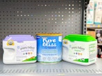 three containers of similac pure bliss formula on shelf