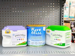 three containers of similac pure bliss formula on shelf