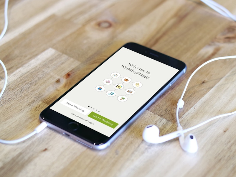 an iphone with the weddinghappy app pulled up on it