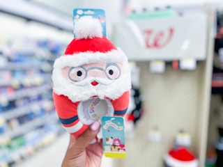 hand holding squishmallow slippers