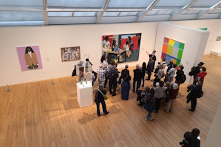 Group of people inside an art gallery.