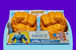 Marvel Studios’ The Fantastic Four Clobbering Fists on a blue background.