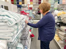 A woman shopping for towels at Kohl's