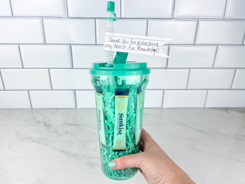 a person holding a tumbler drink teacher gift 