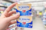 hand holding two boxes of st. joseph aspirin
