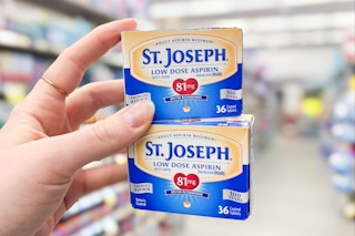 hand holding two boxes of st. joseph aspirin