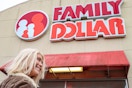 a person smiling outside of a family dollar store