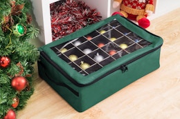 Tiny Tim Totes Ornament Storage Box - Zippered Organizer next to a Christmas tree.