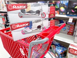 2 razor scooters sitting on a target cart
