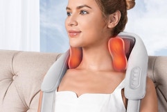 a woman wearing a neck massager