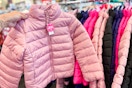 Hand holding kids coat
