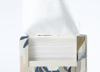 a box of disposable face towels