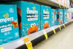 pampers diaper boxes in a store aisle with a clearance tag