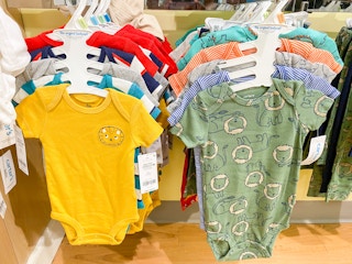 two racks full of carters bodysuits multipacks side by side in kohls