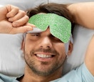 a man wearing a steam eye mask