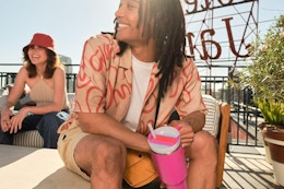 a stanley quencher being held