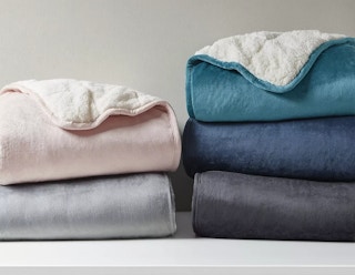 weighted blankets folded on shelf