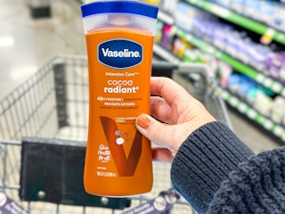hand holding a bottle of vaseline lotion