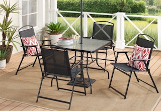 gray chair and dining table on a patio 
