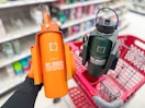 hand holding an iron flask water bottle in front of a target cart
