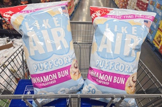 2 bags of like air puffcorn in a cart
