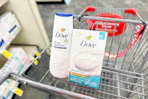 dove body wash and bar soaps in a cart