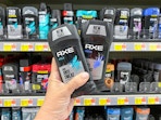 2 Axe Deodorant Sticks held up in deodorant aisle in Walmart stores
