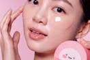 a woman using tonymoly under-eye patches