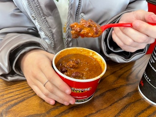 someone spooning firehouse subs chili