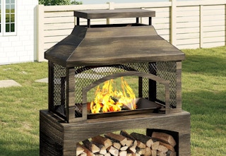 large freestanding fire pit with log storage