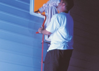 a person rescuing a child on an escape ladder