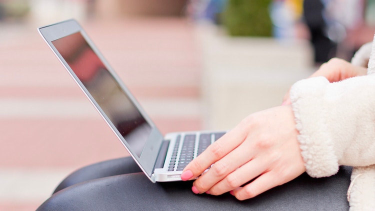 Macbook air on someone's lap