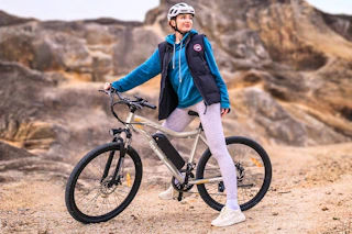 Lifestyle image of adult on electric bike outdoors