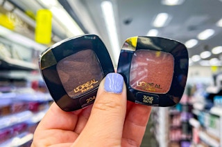 hand holding 2 L'oreal eyeshadow singles