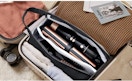 air styler attachments in a bag in a suitcase