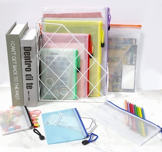 a stack of zippered mesh pouches