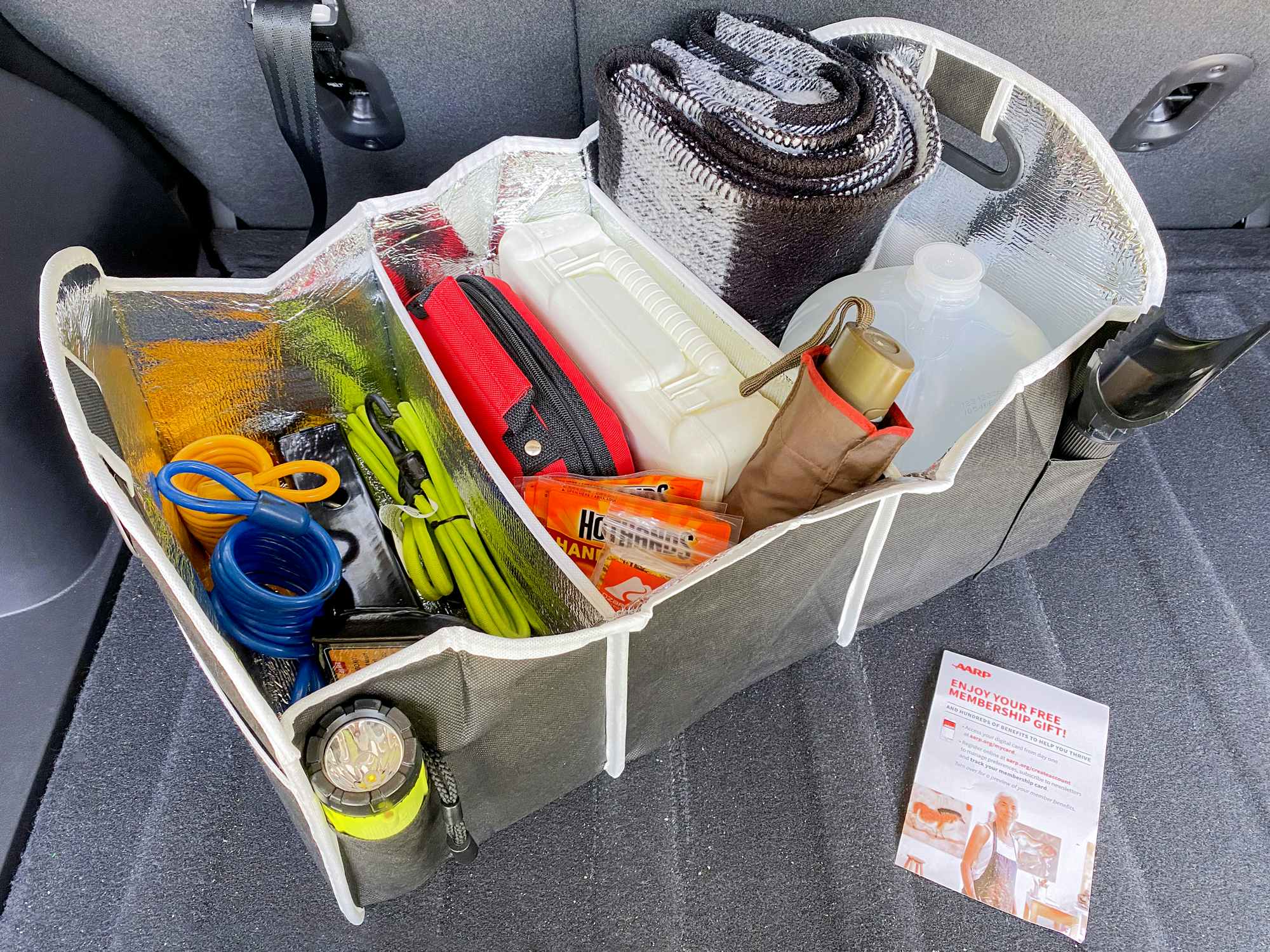 aarp free trunk organizer new member gift with supplies and information card in trunk