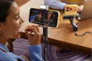 woman watching video using phone stand holder