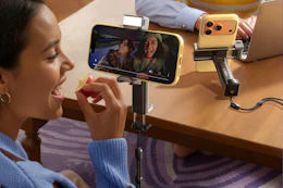 woman watching video using phone stand holder